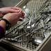 Volunteer Sharon Nakpairat organizes washed silverware at St. Frances Church on Friday, March 8. Daniel Brenner I AnnArbor.com